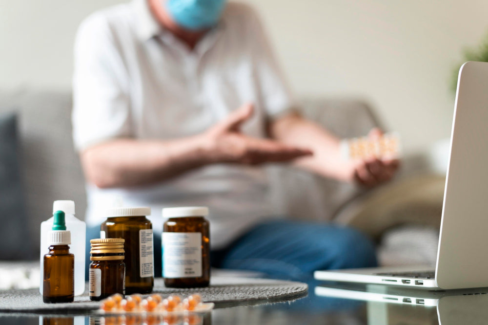Essential tremor medication bottles and pills on a table as a person manages hand tremors during treatment.